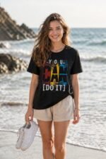 Main product photo for the You Can Do It positive affirmation t-shirt. This pure cotton black tee showcases a striking, colorful text design, perfect for daily motivation, goal-setters, and ambitious dreamers.