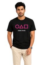 Man wearing a black cotton Men's Squid Game Inspired Graphic Printed T-Shirt with circle, triangle, and square symbols