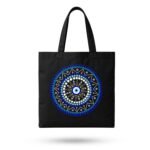 Product shot of a black canvas Boho Evil Eye Graphic Tote Bag with blue mandala design – spiritual aesthetic accessory