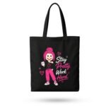 Black canvas aesthetic tote bag with pink "Stay Pretty Work Hard" motivational graphic – stylish daily carry for women