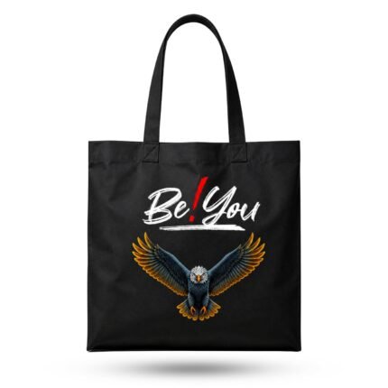 Black canvas tote bag with "Be You" eagle graphic – empowering accessory to pair with a Love Bangla Tee