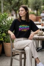 Main product photo for the Bindas Attitude t-shirt. This pure cotton black tee showcases a colorful, graffiti-style 'Bindas' graphic, perfect for expressing a chill, fearless, and worry-free vibe.