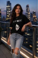 Woman wearing a Batman-Joker Looser graphic t-shirt against a city night skyline – edgy joker looser t-shirt lifestyle shot