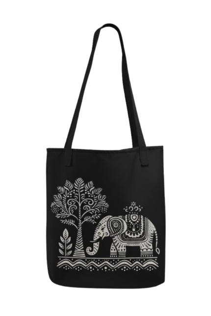 Black canvas tote bag featuring a white tribal elephant and folk-art tree design – eco-friendly cultural accessory