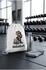 Hypebeast teddy bear millionaire mindset white drawstring bag standing on urban concrete ground