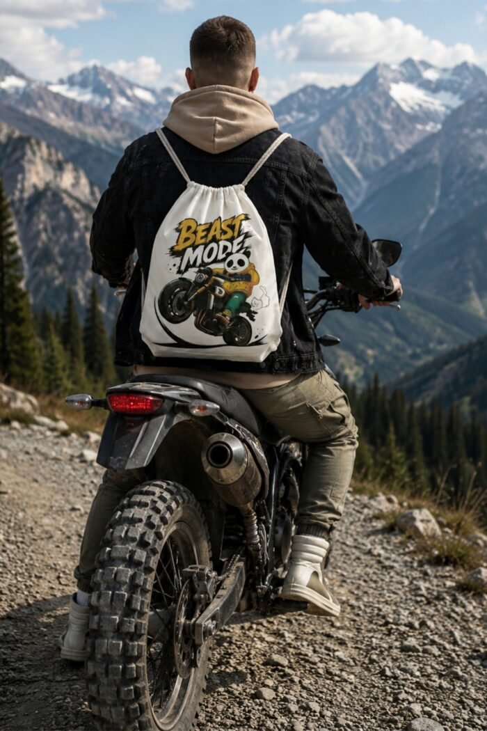 Streetwear fashion aesthetic featuring a heavy duty graphic drawstring backpack worn over a black sweatshirt.
