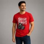 Male model wearing a red Stilotee graphic t-shirt with 'Street Smart' typography