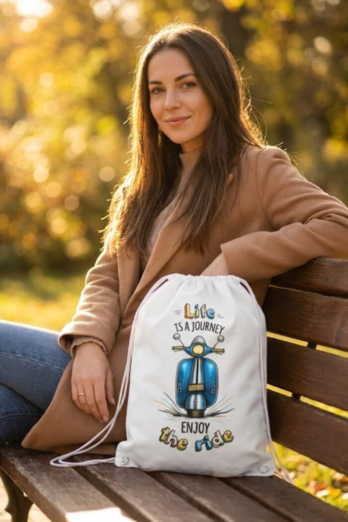 Model wearing a brown jacket showcasing the Stilotee white canvas drawstring backpack with vintage blue scooter graphic