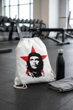 A closeup view of the premium heavyweight cotton canvas texture and heavy-duty dual-cord shoulder straps on the Che Guevara drawstring backpack.