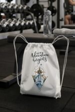 Close-up view of the White Durable Canvas Drawstring Bag with clear details of the cinch closure ropes and adventure graphic.