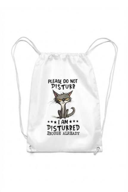 A white canvas drawstring backpack featuring a funny minimalist graphic illustration of a chaotic, grumpy grey cat with yellow eyes and text that reads "Please Do Not Disturb" and "I Am Disturbed Enough Already".