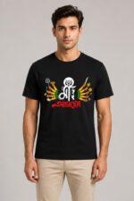 Male model wearing regular fit jet black graphic t-shirt featuring Bengali typography Maa Aaschen with Maa Durga ten hands illustration for Durga Puja festival.