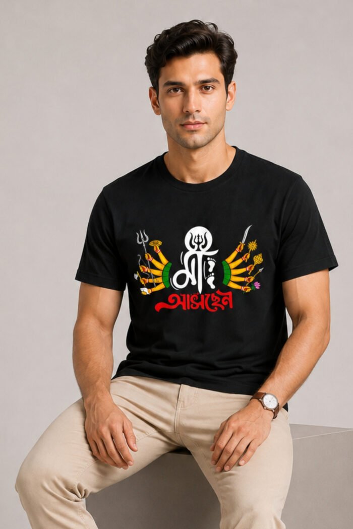 Front angle view of male model wearing black Durga Puja special Bengali graphic t-shirt with Maa typography and Trishul design.