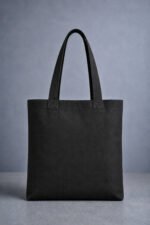 Plain back view of midnight black heavyweight canvas tote bag with reinforced dual shoulder straps